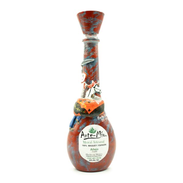 botella artesanal de mezcal arte mio color rojo con manchas azules